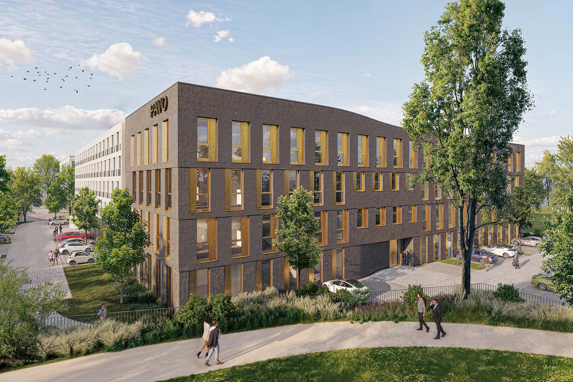 Modernes Bürogebäude mit brauner Fassade und gelben Fensterrahmen, Schriftzug 'PAVO' oben rechts, umgeben von Bäumen und Parkplätzen.